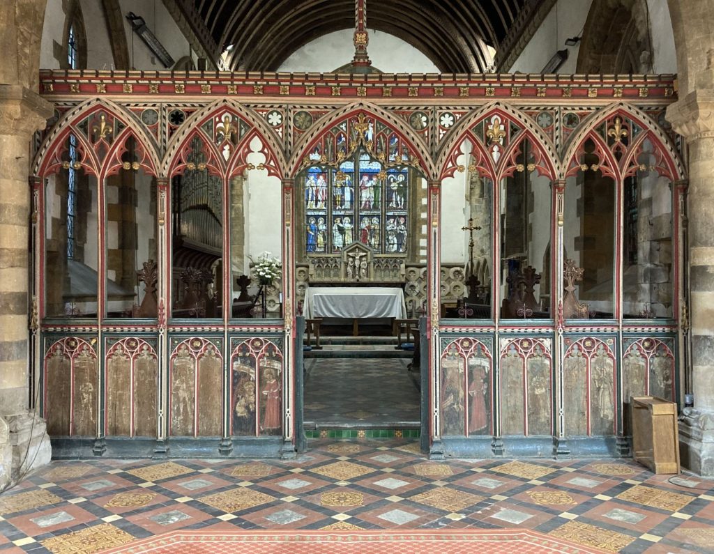The painted rood screen and chancel inside St Mary's Church, Bloxham